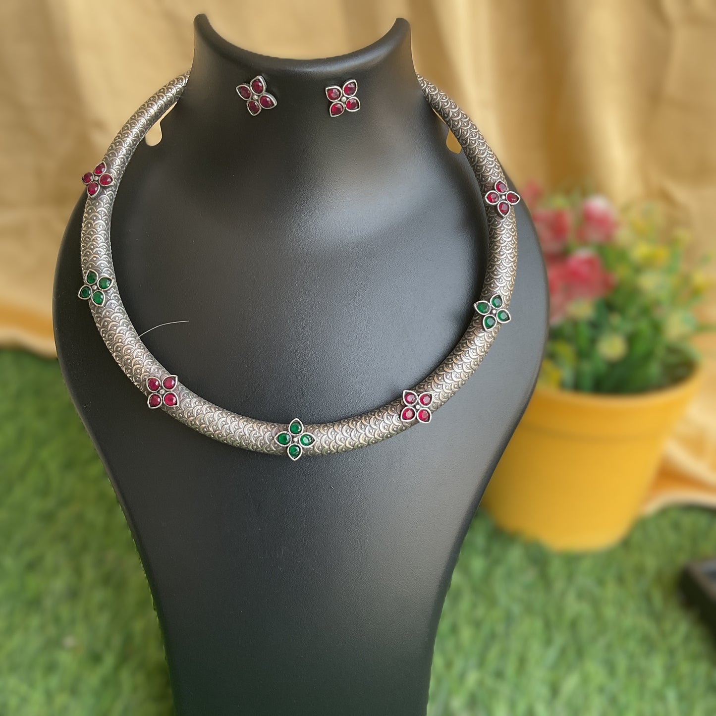 Kripika red and green flower motifs handcarved silver plated hasuli necklace