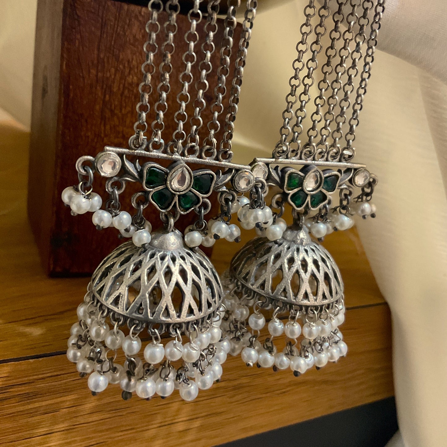 Haritika 925 Silver Plated Green Stone Long Jhumka Earrings
