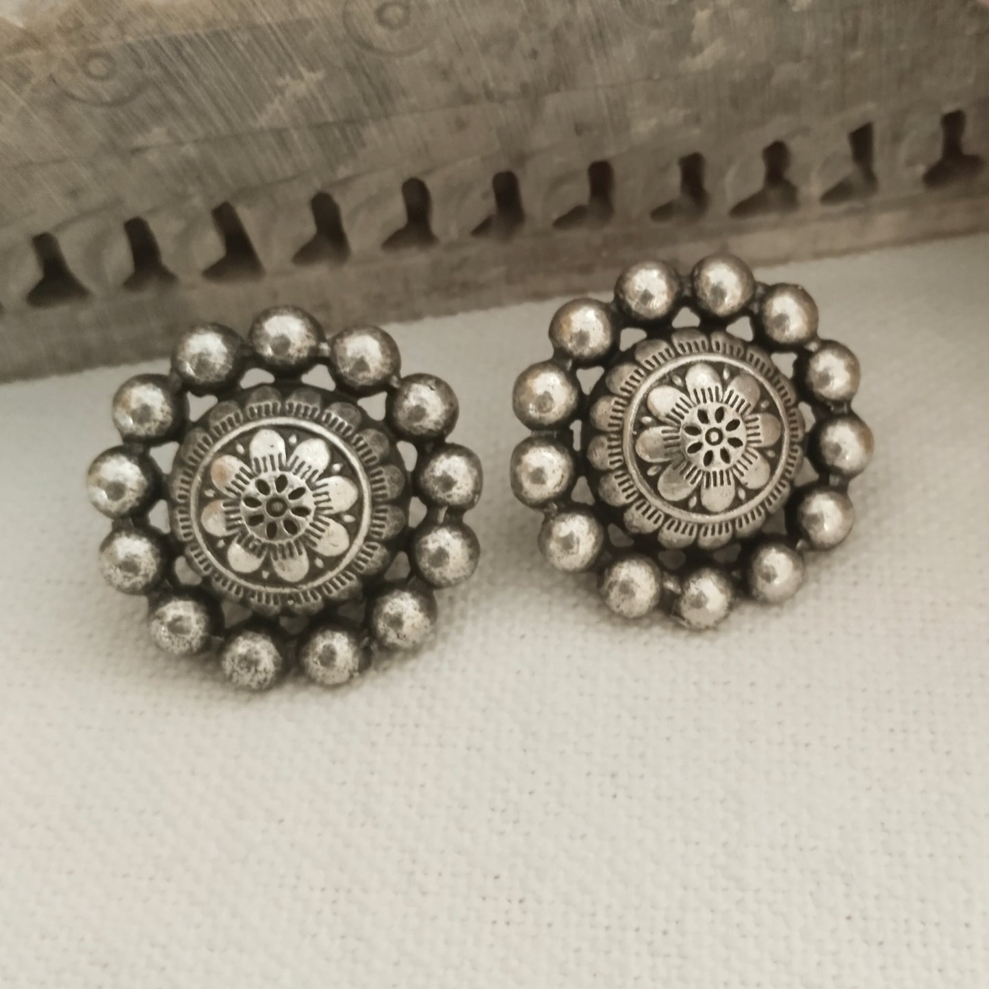 Kailaashi circular silver look studs