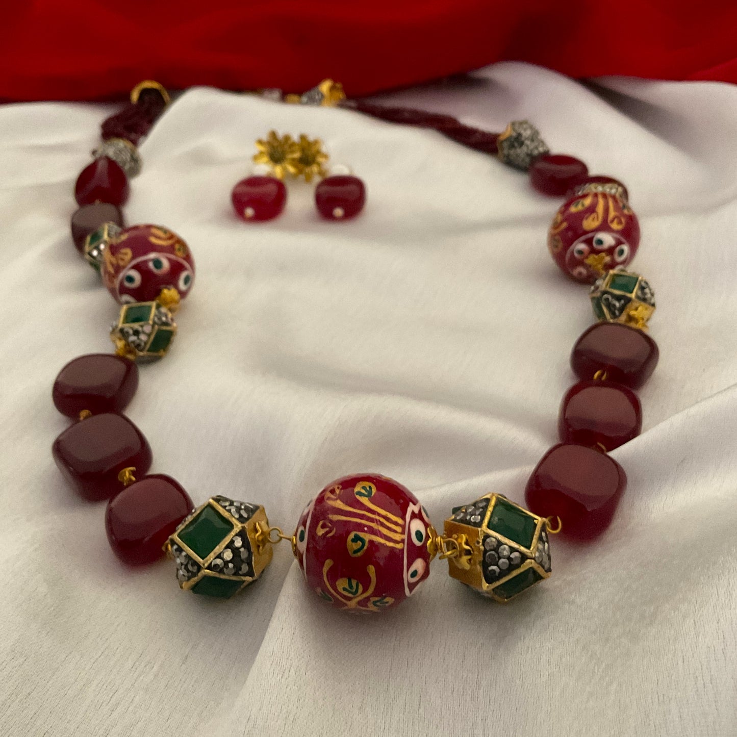 Aarya maroon hand painted beads stone gold plated neck mala with earrings