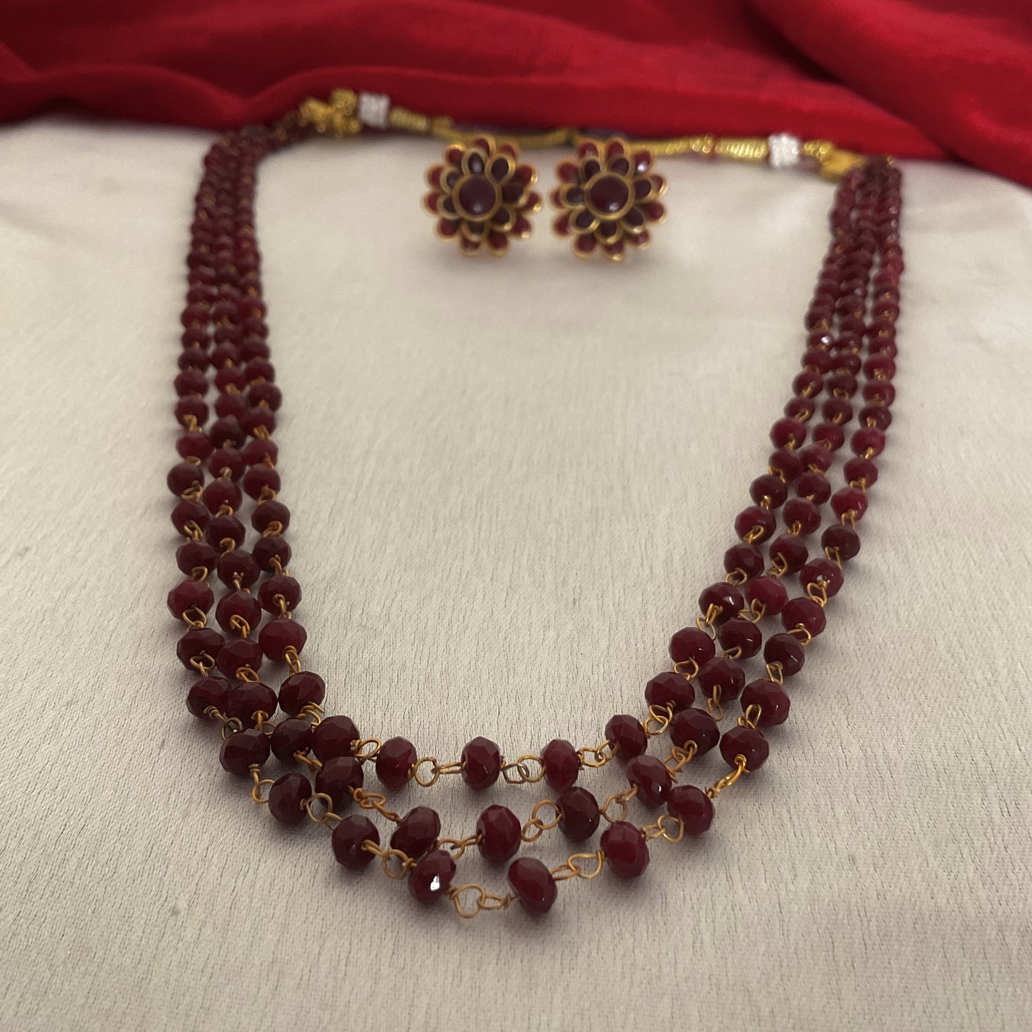 Gaurangi maroon jade 3 layer mala with studs